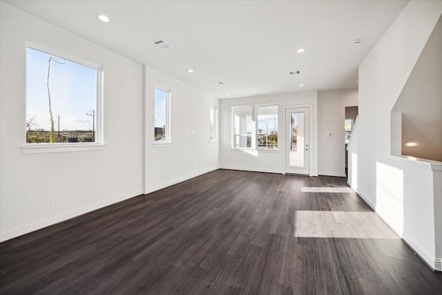 1812 Elysian St, Houston, TX 77026 - unfurnished living room featuring dark wood-type flooring and recessed lighting