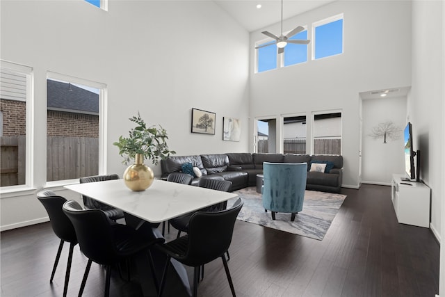 8814 Riverton Ridge Rd, Cypress, TX 77433 - dining area with a high ceiling, ceiling fan, and dark wood-style floors