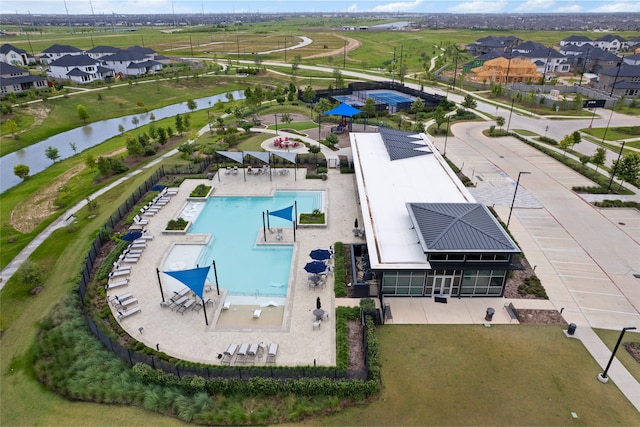 8814 Riverton Ridge Rd, Cypress, TX 77433 - aerial perspective of suburban area featuring a pool area and a nearby body of water
