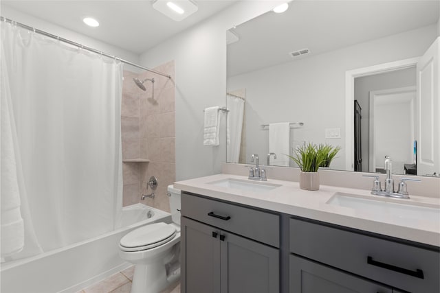 8814 Riverton Ridge Rd, Cypress, TX 77433 - bathroom featuring double vanity, shower / bath combination with curtain, tile patterned floors, and recessed lighting