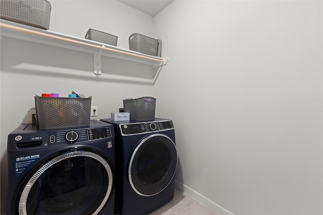 8814 Riverton Ridge Rd, Cypress, TX 77433 - laundry area featuring independent washer and dryer and tile patterned flooring