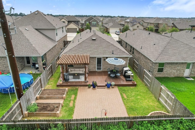 19919 Epirus Shores Dr, Hockley, TX 77447 - rear view of property featuring a wooden deck, a residential view, a fenced backyard, and a vegetable garden