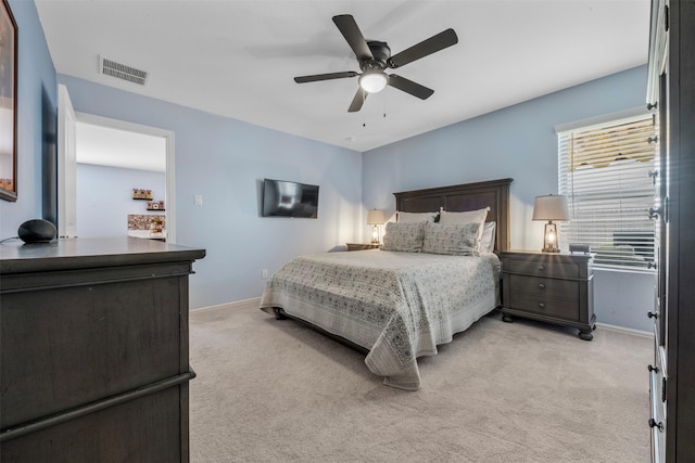 19919 Epirus Shores Dr, Hockley, TX 77447 - bedroom with light colored carpet and ceiling fan