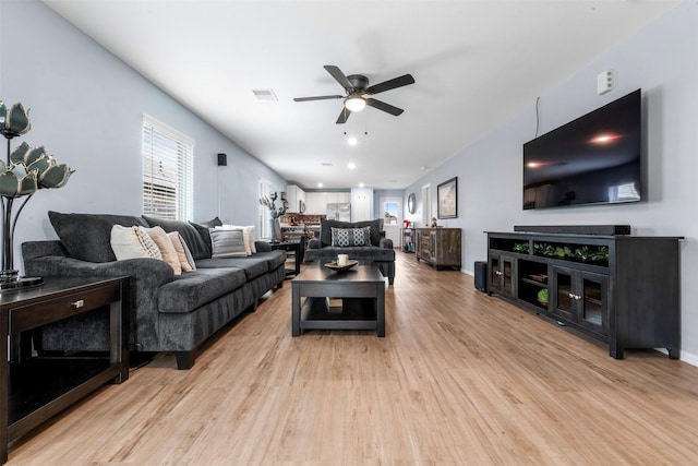 19919 Epirus Shores Dr, Hockley, TX 77447 - living room with ceiling fan and light wood-style floors