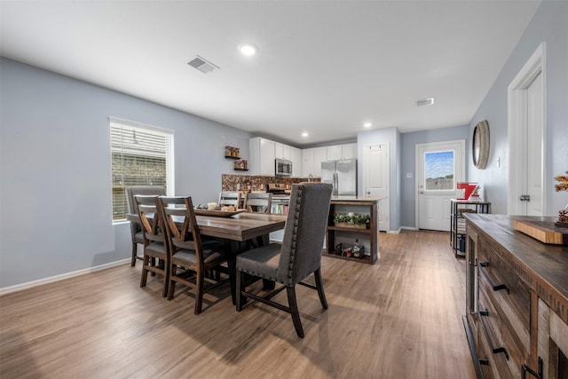 19919 Epirus Shores Dr, Hockley, TX 77447 - dining space featuring light wood-type flooring and recessed lighting