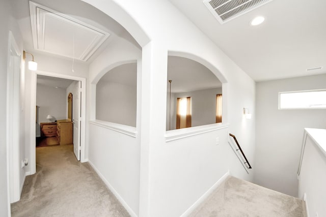 12306 Belhaven Terrace Dr, Houston, TX 77044 - corridor with attic access, light colored carpet, an upstairs landing, recessed lighting, and arched walkways