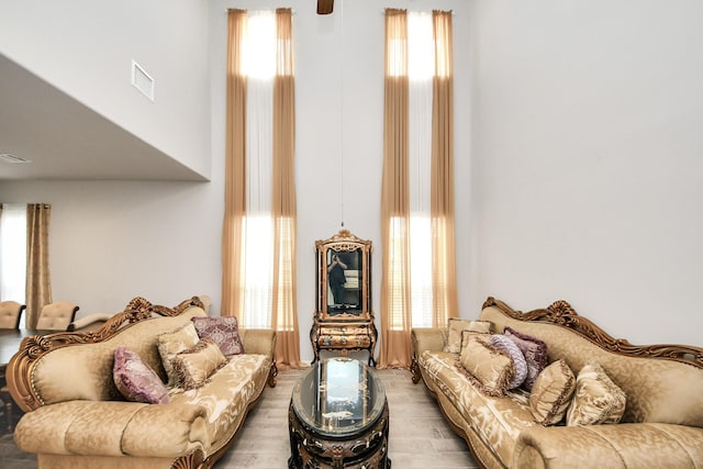12306 Belhaven Terrace Dr, Houston, TX 77044 - living area featuring light wood-style floors and a high ceiling