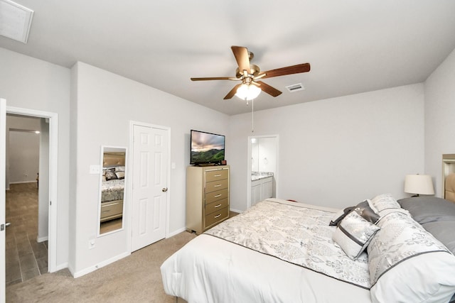 12306 Belhaven Terrace Dr, Houston, TX 77044 - bedroom with light carpet, a ceiling fan, and ensuite bathroom