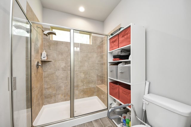 12306 Belhaven Terrace Dr, Houston, TX 77044 - full bathroom with a stall shower and wood finished floors