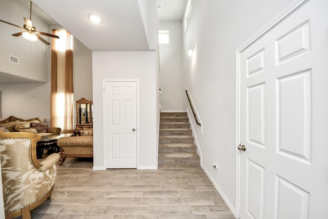 12306 Belhaven Terrace Dr, Houston, TX 77044 - staircase featuring ceiling fan, wood finished floors, and recessed lighting