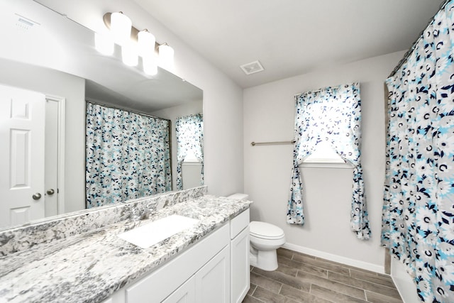 12306 Belhaven Terrace Dr, Houston, TX 77044 - bathroom featuring vanity, curtained shower, and wood tiled floors