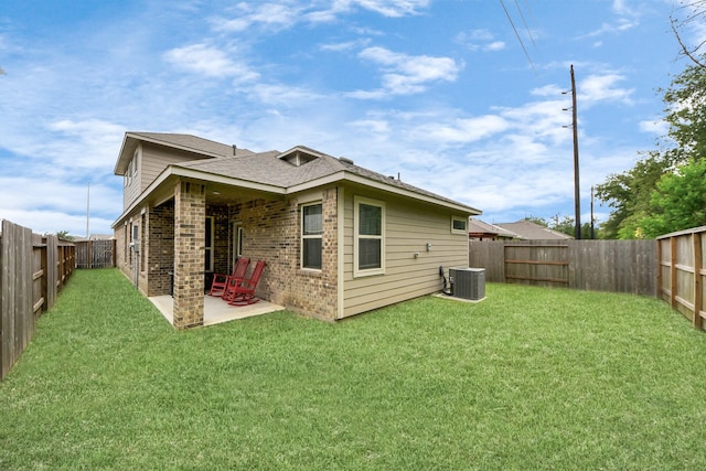 12306 Belhaven Terrace Dr, Houston, TX 77044 - back of property with brick siding, a patio area, a fenced backyard, and a shingled roof