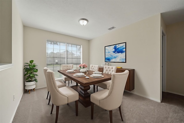11423 Sunny Creek Dr, Houston, TX 77066 - carpeted dining space with baseboards