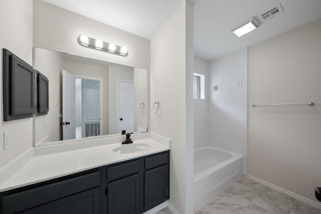 11423 Sunny Creek Dr, Houston, TX 77066 - full bath featuring marble look tile flooring, vanity, and shower / bath combination