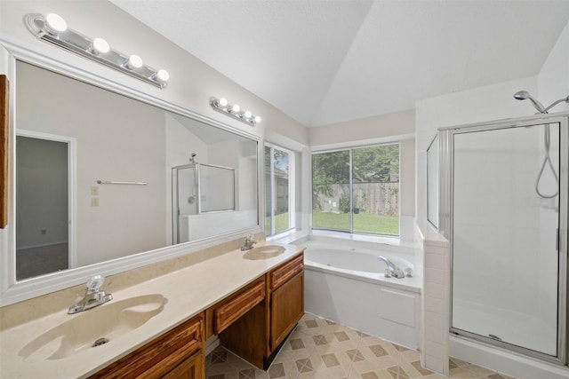 11423 Sunny Creek Dr, Houston, TX 77066 - bathroom with a stall shower, vaulted ceiling, a bath, and double vanity