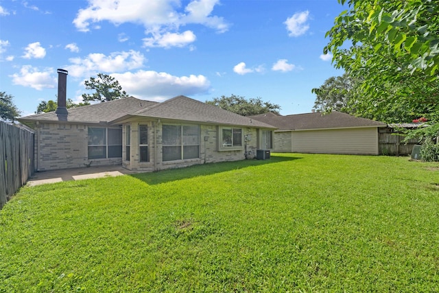 11423 Sunny Creek Dr, Houston, TX 77066 - back of house with a fenced backyard, brick siding, a patio area, and roof with shingles