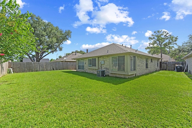 11423 Sunny Creek Dr, Houston, TX 77066 - back of property featuring a fenced backyard, brick siding, and roof with shingles