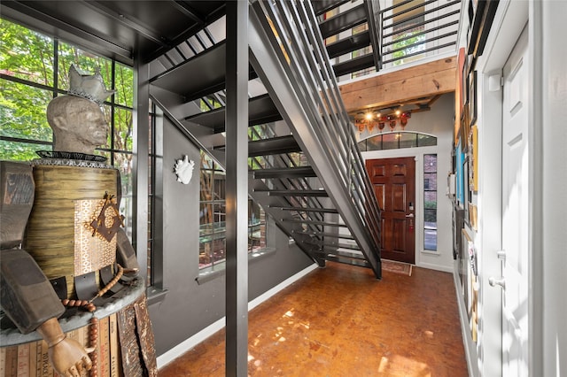 2614 Yoakum Blvd, Houston, TX 77006 - foyer with finished concrete flooring and stairs
