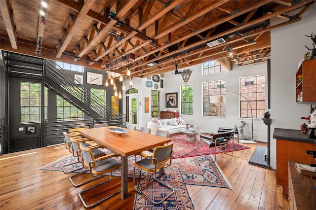 2614 Yoakum Blvd, Houston, TX 77006 - dining area with hardwood / wood-style flooring and a wooden ceiling with exposed beams