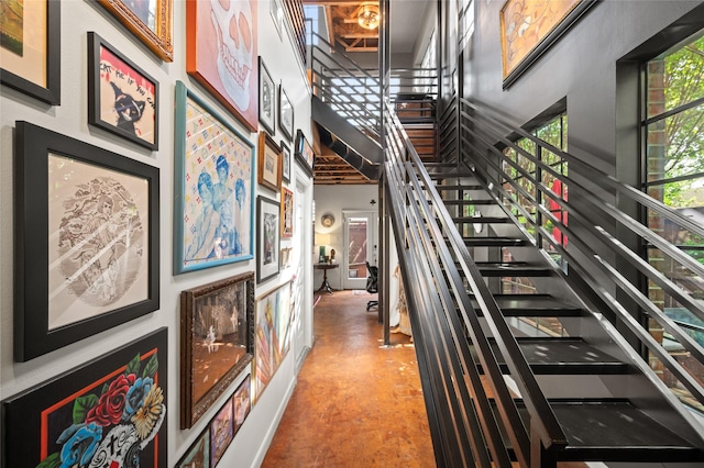 2614 Yoakum Blvd, Houston, TX 77006 - staircase with concrete flooring and a high ceiling