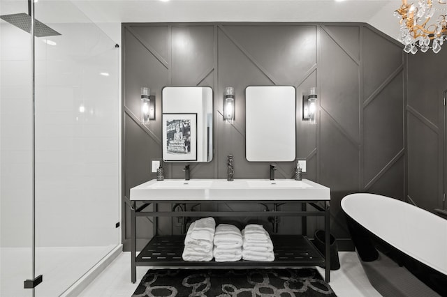 2614 Yoakum Blvd, Houston, TX 77006 - bathroom with a decorative wall, a shower stall, a freestanding bath, and double vanity
