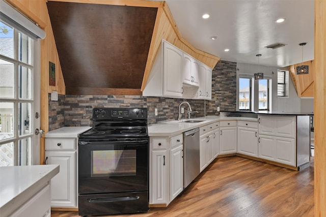 12901 E Barcelona, Galveston, TX 77554 - kitchen with black range with electric cooktop, stainless steel dishwasher, tasteful backsplash, white cabinets, and recessed lighting