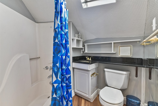 12901 E Barcelona, Galveston, TX 77554 - bathroom with lofted ceiling, a shower with shower curtain, wood finished floors, and vanity