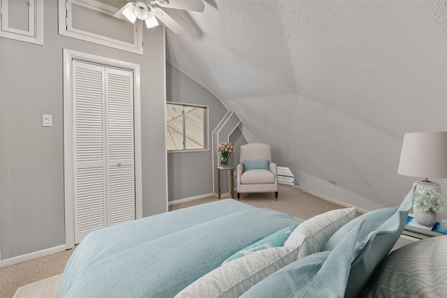 12901 E Barcelona, Galveston, TX 77554 - carpeted bedroom with lofted ceiling, a textured ceiling, a closet, and a ceiling fan