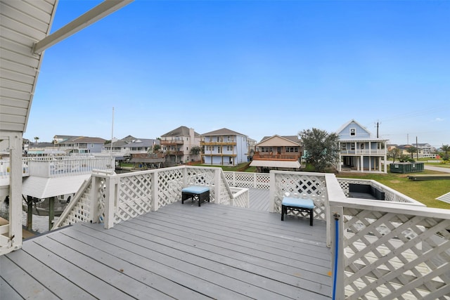 12901 E Barcelona, Galveston, TX 77554 - wooden deck with a residential view