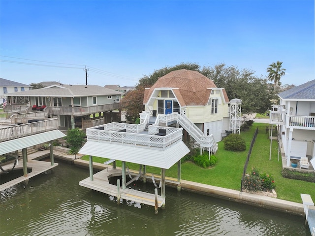 12901 E Barcelona, Galveston, TX 77554 - rear view of property with boat lift, a lawn, a residential view, stairs, and a deck with water view