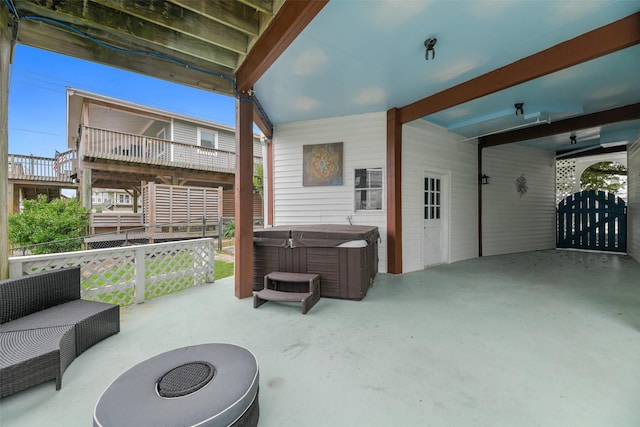 12901 E Barcelona, Galveston, TX 77554 - view of patio featuring a hot tub and a gate