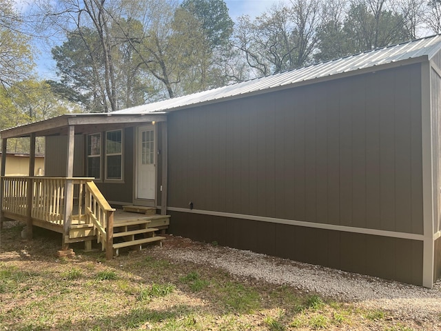 174 Jaycrest, Livingston, TX 77351 - rear view of house featuring a metal roof