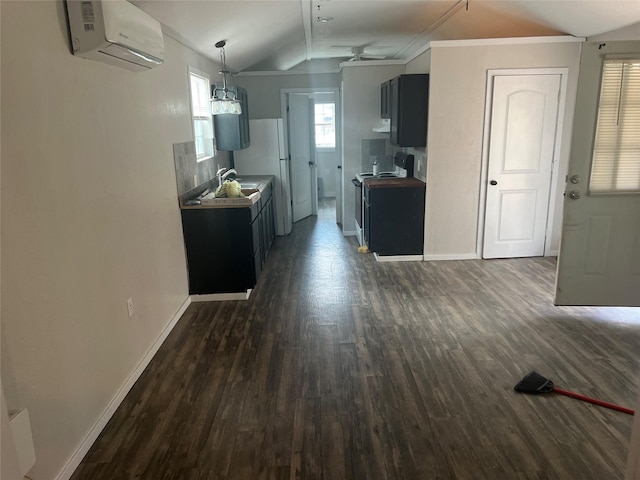 174 Jaycrest, Livingston, TX 77351 - kitchen with a wall mounted AC, lofted ceiling, dark wood-style floors, stove, and ceiling fan