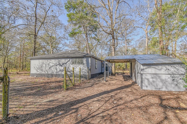 3735 Woodpeckers Grv, Cleveland, TX 77328 - view of outbuilding featuring a carport