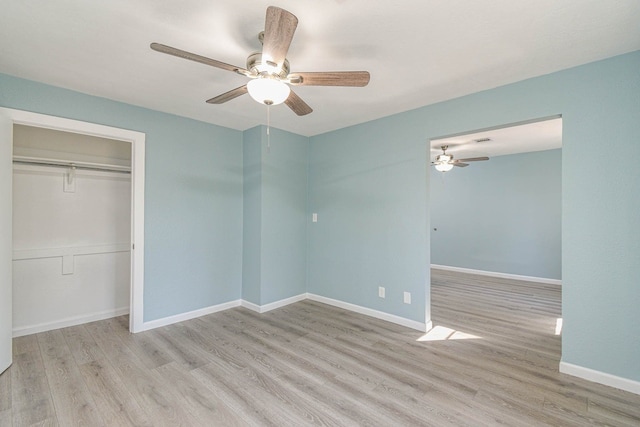 3735 Woodpeckers Grv, Cleveland, TX 77328 - unfurnished bedroom featuring wood finished floors, a closet, and ceiling fan