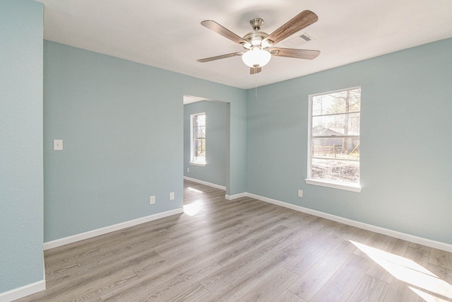 3735 Woodpeckers Grv, Cleveland, TX 77328 - spare room featuring ceiling fan and wood finished floors