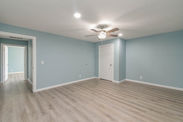 3735 Woodpeckers Grv, Cleveland, TX 77328 - spare room with ceiling fan, light wood-style floors, recessed lighting, and a textured ceiling
