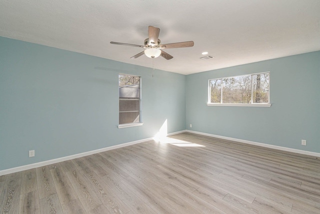 3735 Woodpeckers Grv, Cleveland, TX 77328 - spare room featuring a ceiling fan, wood finished floors, and recessed lighting