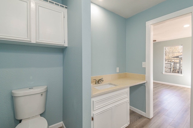 3735 Woodpeckers Grv, Cleveland, TX 77328 - bathroom with vanity and wood finished floors