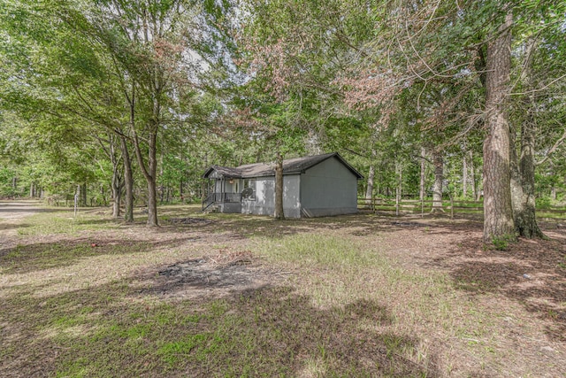3735 Woodpeckers Grv, Cleveland, TX 77328 - view of yard featuring a wooded view