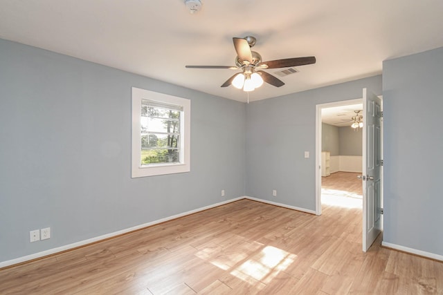 3735 Woodpeckers Grv, Cleveland, TX 77328 - unfurnished room featuring ceiling fan, a smoke detector, and light wood-style flooring