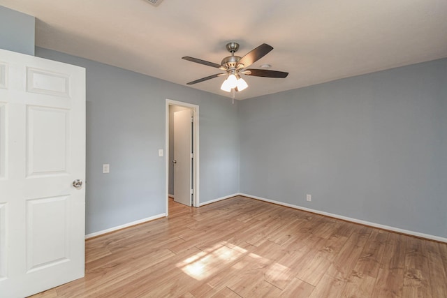 3735 Woodpeckers Grv, Cleveland, TX 77328 - unfurnished room with a ceiling fan and light wood-style flooring