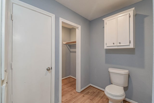 3735 Woodpeckers Grv, Cleveland, TX 77328 - bathroom with wood finished floors and toilet