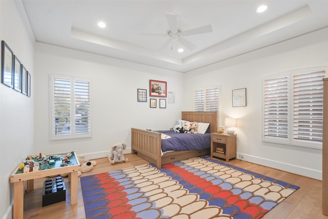 2804 Robinhood St, West University Place, TX 77005 - bedroom with a raised ceiling, wood finished floors, recessed lighting, and a ceiling fan