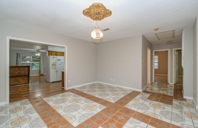 10131 Tangiers Rd, Houston, TX 77041 - unfurnished room with attic access, light tile patterned floors, and a ceiling fan