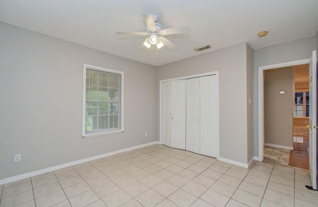 10131 Tangiers Rd, Houston, TX 77041 - unfurnished bedroom with a closet, light tile patterned floors, and ceiling fan