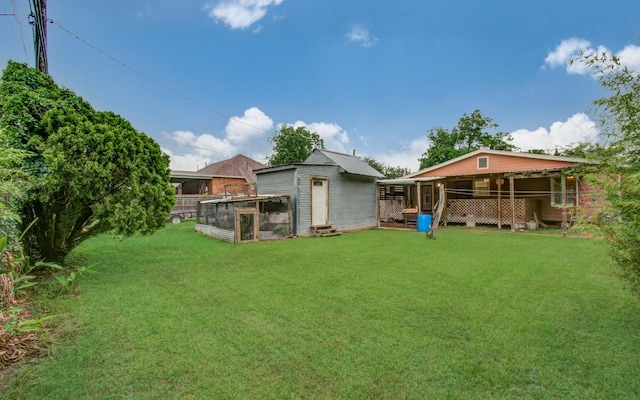10131 Tangiers Rd, Houston, TX 77041 - view of green lawn with an outdoor structure and exterior structure