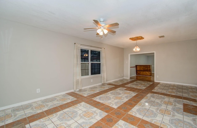 10131 Tangiers Rd, Houston, TX 77041 - tiled empty room featuring ceiling fan and inlaid floor details