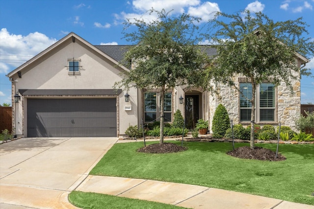 5946 Wedgewood Heights Way, Houston, TX 77059 - view of front of property with stucco siding, a front lawn, concrete driveway, and stone siding