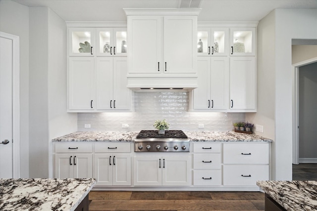 5946 Wedgewood Heights Way, Houston, TX 77059 - kitchen featuring stainless steel gas stovetop, light stone counters, white cabinetry, and decorative backsplash